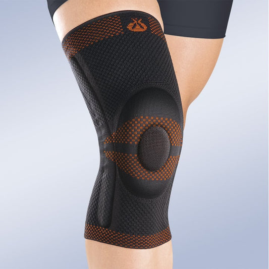 CLOSED PATELLA KNEE BRACE W/SILICONE PAD AND LATERAL FLEXIBLE REINFORCEMENT